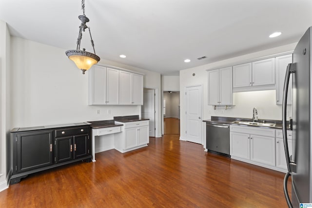 kitchen with sink, stainless steel appliances, dark hardwood / wood-style floors, and white cabinets