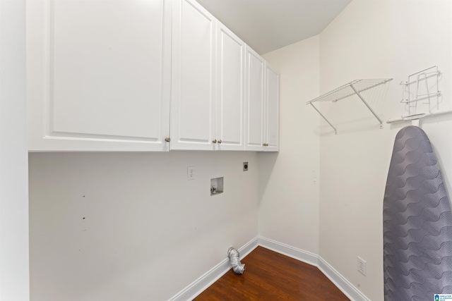 washroom featuring cabinets, washer hookup, hookup for an electric dryer, and dark hardwood / wood-style flooring