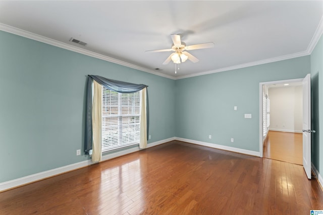 spare room featuring crown molding, hardwood / wood-style flooring, and ceiling fan