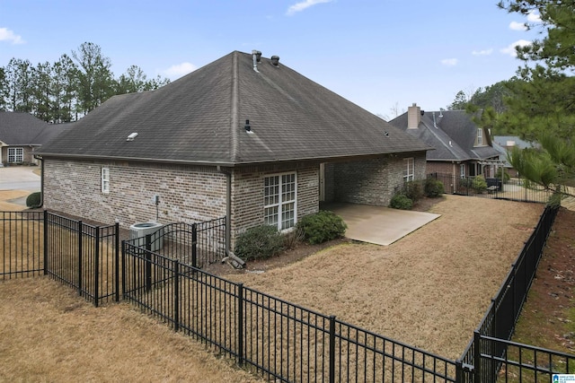 back of property featuring a patio area