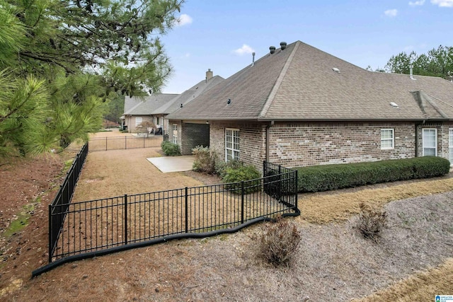 rear view of property with a patio area