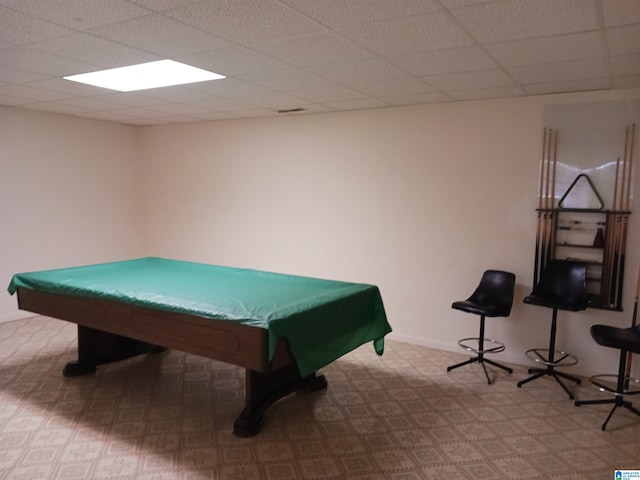 recreation room featuring a paneled ceiling