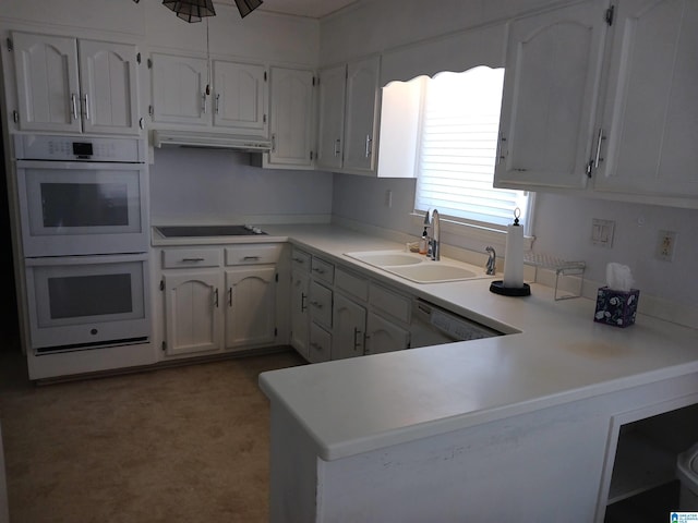 kitchen featuring white double oven, dishwashing machine, sink, black electric stovetop, and white cabinets