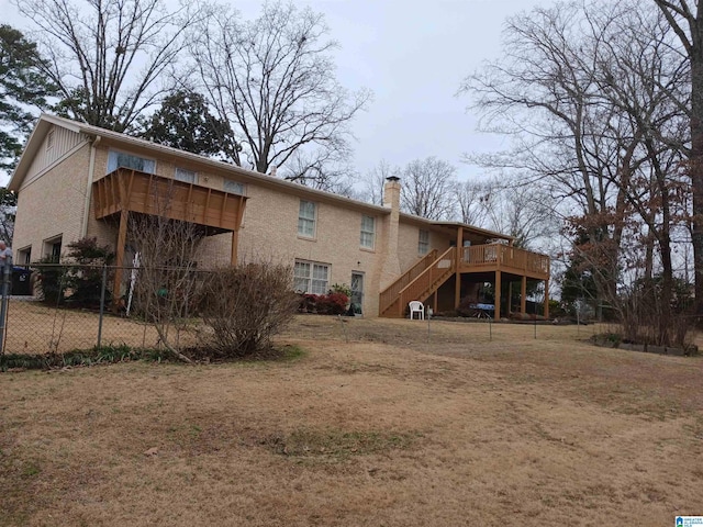 back of property featuring a deck