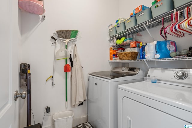 clothes washing area featuring washing machine and clothes dryer