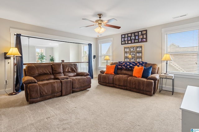 living room with ceiling fan, a healthy amount of sunlight, and carpet floors