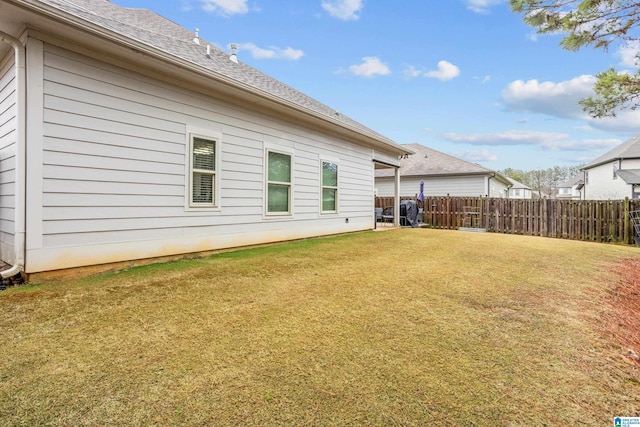 back of house with a yard