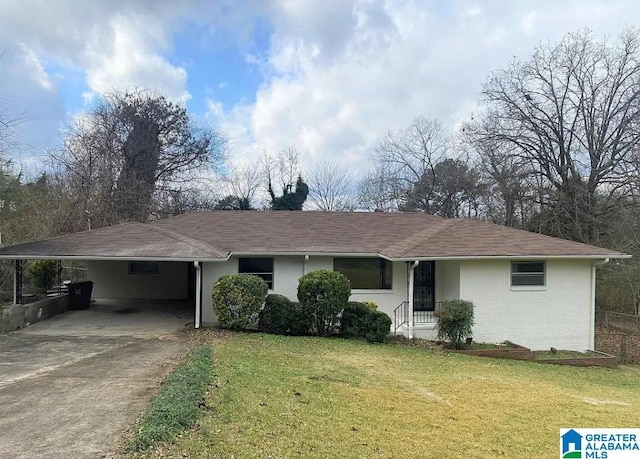 single story home with a front yard and a carport