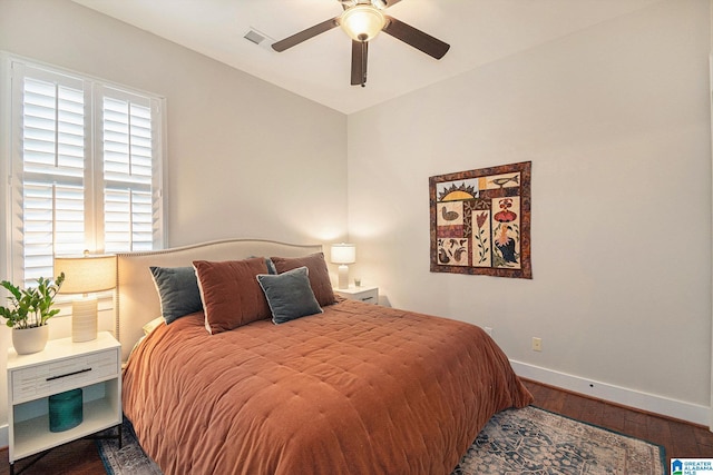 bedroom with hardwood / wood-style flooring and ceiling fan