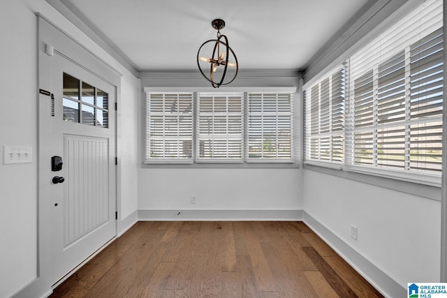 interior space with hardwood / wood-style floors and a notable chandelier