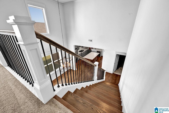 stairway featuring wood-type flooring