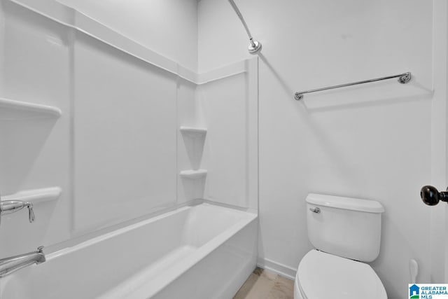 bathroom with toilet and washtub / shower combination