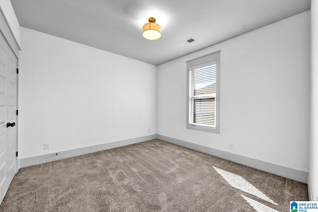 empty room featuring carpet flooring