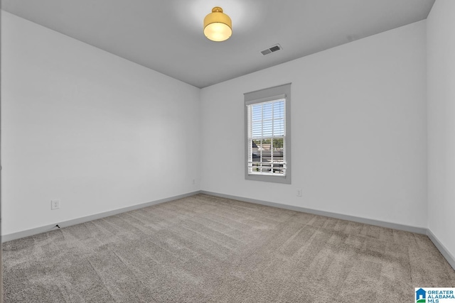 empty room featuring carpet floors