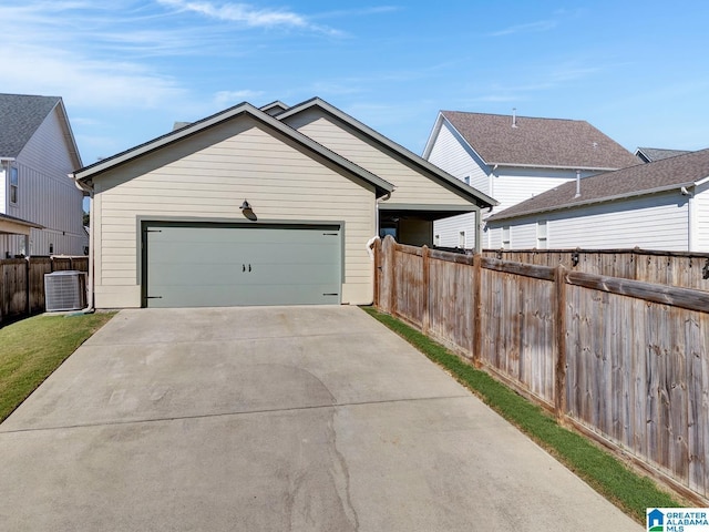 exterior space featuring a garage and central air condition unit