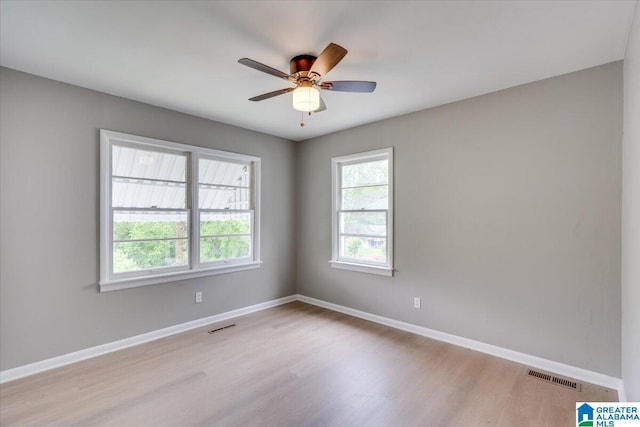 spare room with ceiling fan and light hardwood / wood-style floors