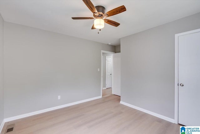 unfurnished room with ceiling fan and light wood-type flooring