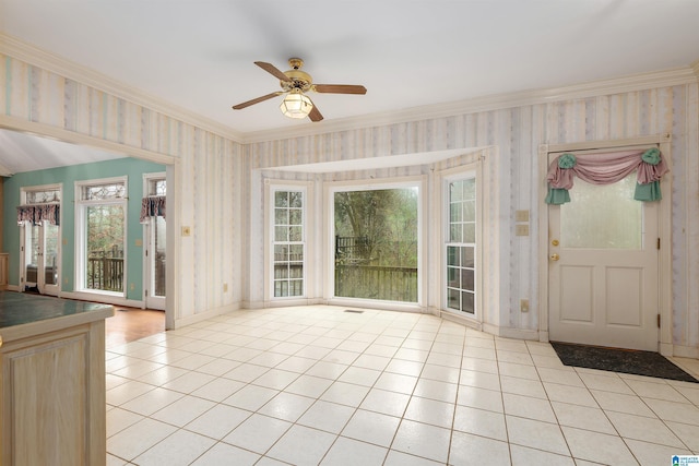 interior space with crown molding and ceiling fan