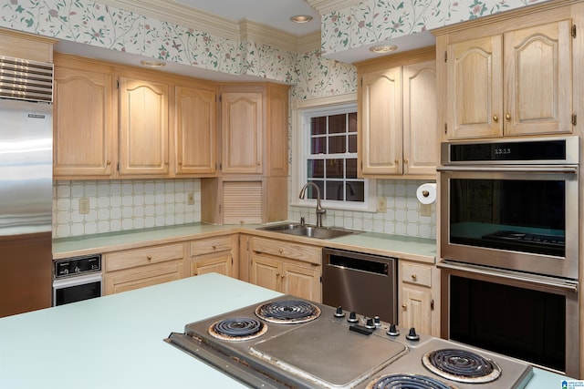 kitchen featuring stainless steel appliances, tasteful backsplash, sink, and light brown cabinets