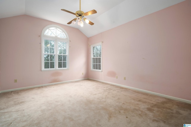 unfurnished room with lofted ceiling, light colored carpet, and ceiling fan