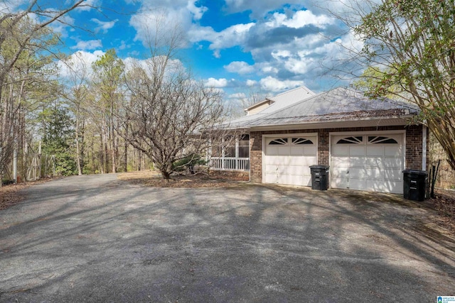 view of side of property featuring covered porch