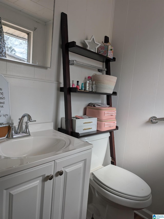 bathroom with vanity and toilet