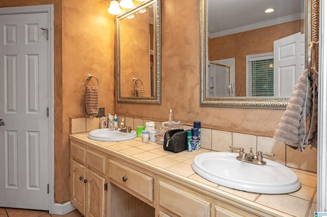 bathroom featuring vanity, tile patterned floors, and ornamental molding