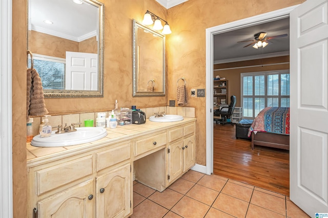 bathroom featuring vanity, tile patterned floors, ornamental molding, and ceiling fan