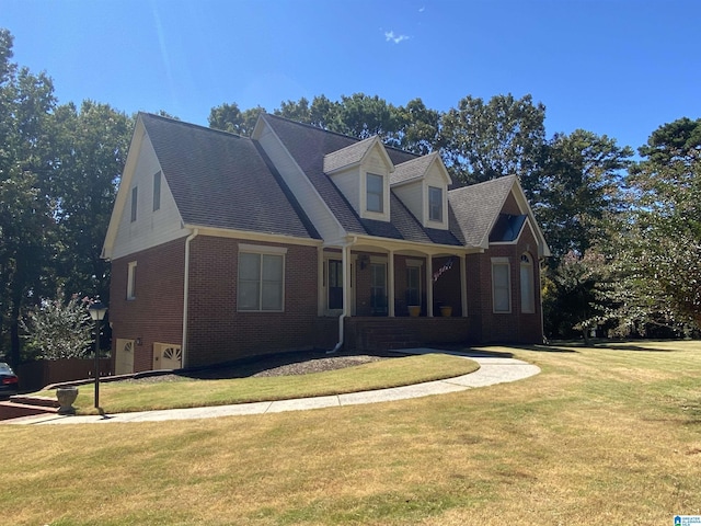 new england style home with a porch and a front lawn