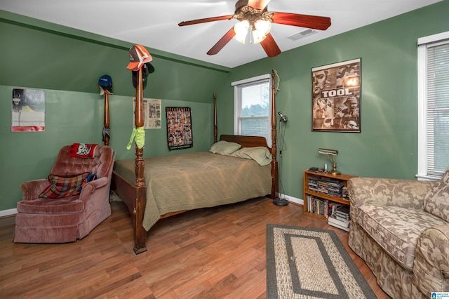 bedroom with hardwood / wood-style floors and ceiling fan