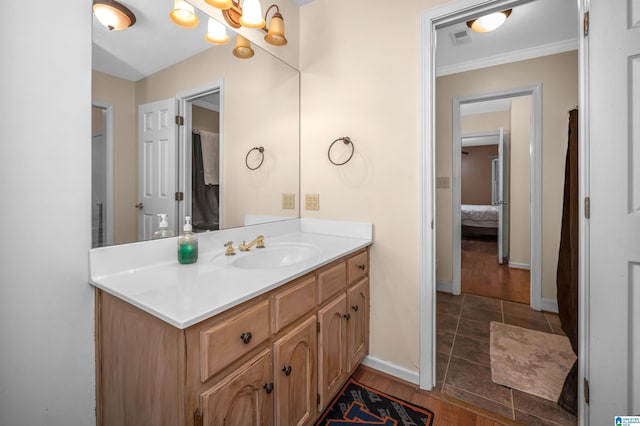 bathroom with vanity and crown molding