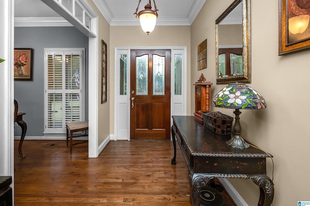 foyer entrance with crown molding and dark hardwood / wood-style flooring