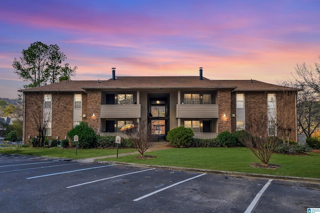 view of outdoor building at dusk