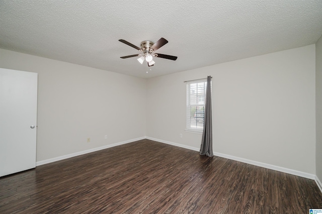 spare room featuring ceiling fan, dark hardwood / wood-style floors, and a textured ceiling