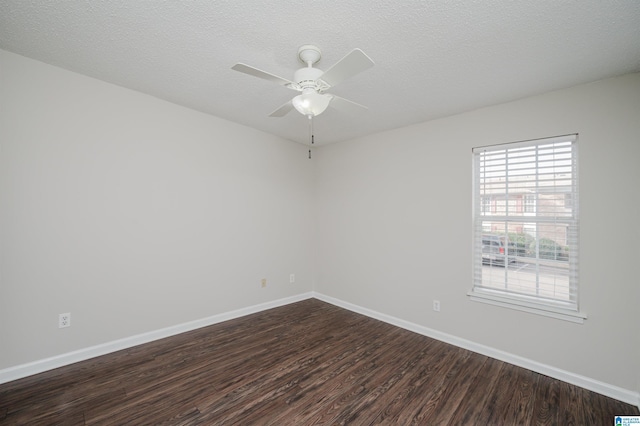 unfurnished room featuring dark hardwood / wood-style floors, a textured ceiling, and ceiling fan