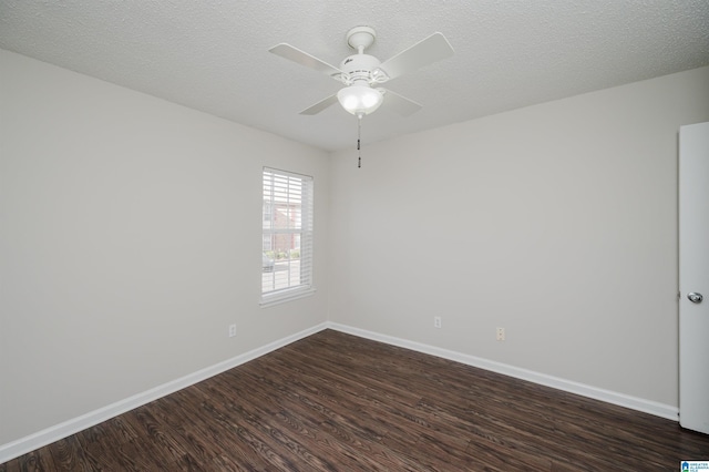 spare room featuring ceiling fan, a textured ceiling, and dark hardwood / wood-style flooring