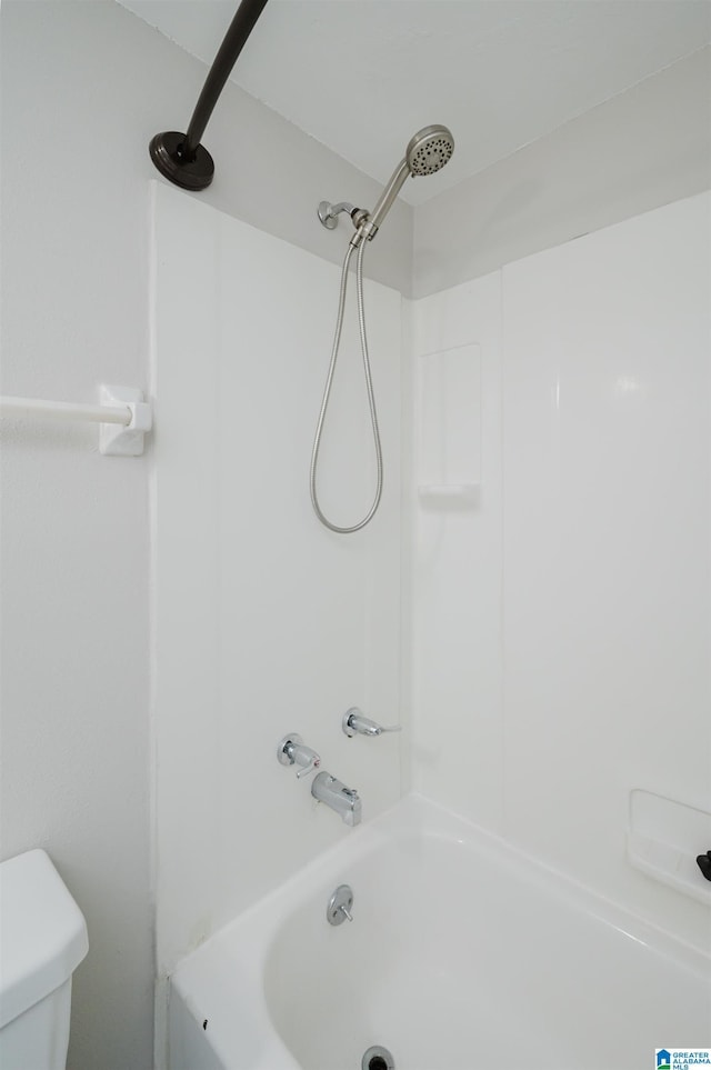 bathroom featuring  shower combination and toilet