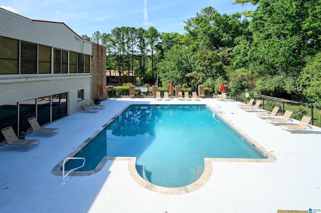 view of swimming pool featuring a patio