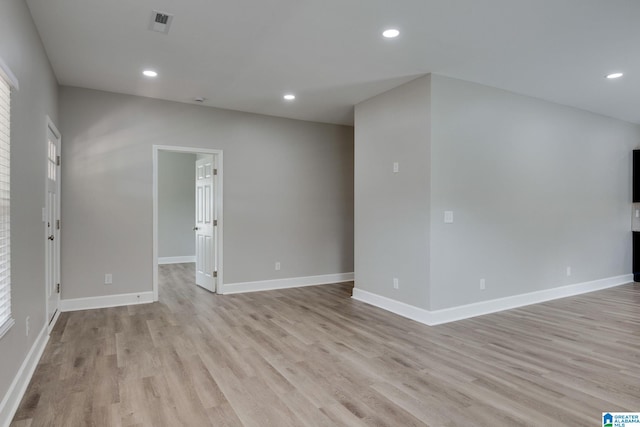 empty room with light hardwood / wood-style flooring