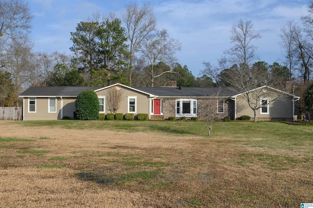 ranch-style house featuring a front lawn