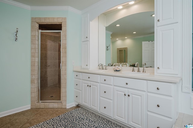 bathroom featuring tile patterned flooring, ornamental molding, vanity, and a shower with shower door