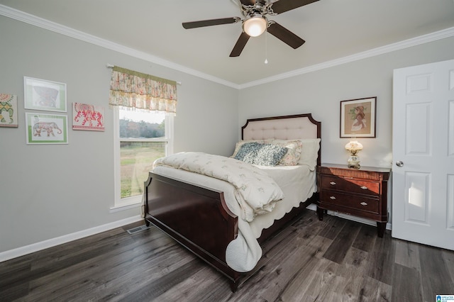 bedroom featuring ceiling fan, ornamental molding, and dark hardwood / wood-style floors