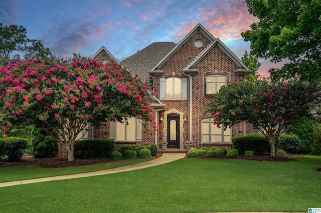 front of property with a lawn