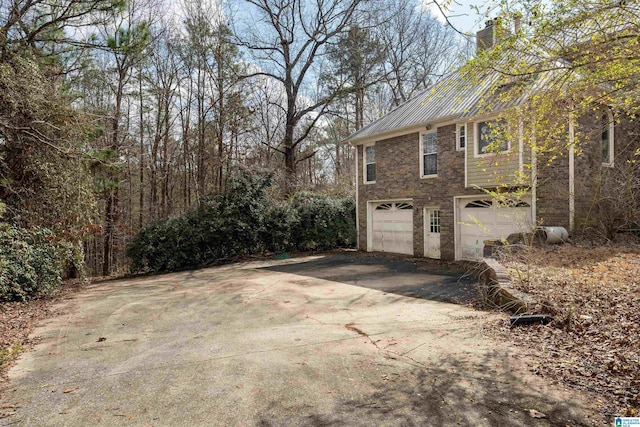 view of side of home featuring a garage