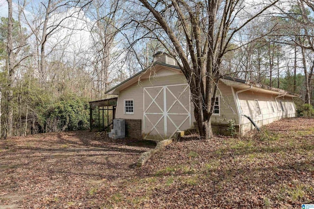 view of home's exterior featuring an outdoor structure