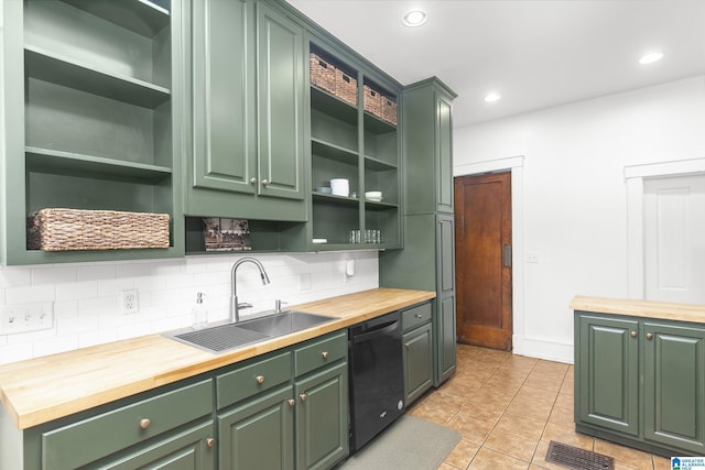 kitchen featuring dishwasher, sink, wood counters, and green cabinetry