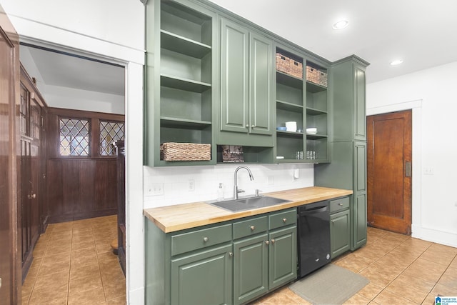 kitchen with dishwasher, sink, green cabinets, and wood counters