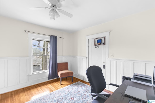 office space with hardwood / wood-style floors and ceiling fan