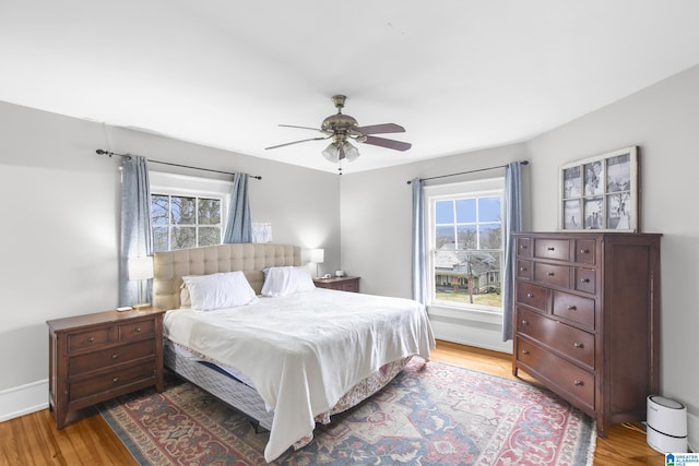 bedroom featuring hardwood / wood-style flooring and ceiling fan