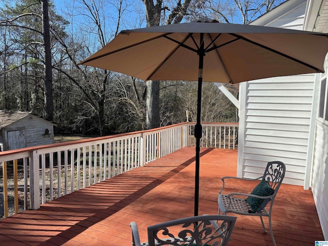 wooden terrace with an outbuilding